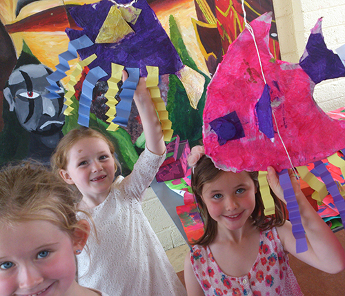 Happy children with their creations